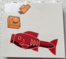 Brick 1 x 4 x 3 with Red Fish and 2 Orange 1 x 1 Plates Pattern