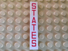 Tile 1 x 6 with Red 'STATES' Pattern