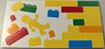Tile 8 x 16 with Bottom Tubes, Textured Surface with Yellow, Orange, Dark Azure, Red and Bright Green Bricks, Brick Wall and Minifigure Pattern Model Right Side