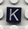 Tile 1 x 1 with Silver Capital Letter K Pattern
