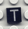Tile 1 x 1 with Silver Capital Letter T Pattern