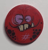 Tile, Round 2 x 2 with Bottom Stud Holder with Globlin Face with 2 Jagged Teeth and 1 Fang Pattern