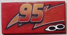 Tile 2 x 4 with Lightning, Exhaust Pipes and Centered '95' Pattern Model Left Side