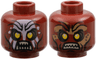 Minifigure, Head Dual Sided Alien Orc with Yellow Eyes, Dark Brown Eye Shadow and Spots, Black Cheek Lines and Chin Dimple, Furrowed Brow, White Face Paint and Angry Open Mouth with Tan Sharp Teeth Parted / Dark Tan Dirt Stains and Bared Teeth Pattern