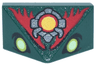 Slope 45 2 x 1 Triple with Bottom Stud Holder with Yellowish Green Eyes, Silver and Yellow Circle Emblem, Red Flames Pattern (The Legend of Zelda Ganondorf Face)